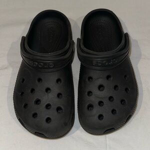 Kids CROCS in all Black with some jibbets